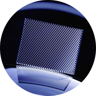Close-up of a cylindrical INGENERIC microlens array wafer.